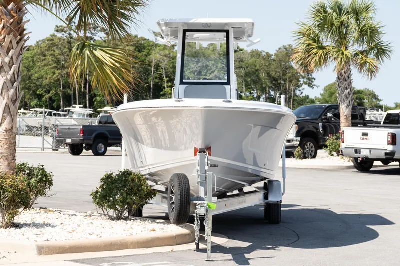 Slide: The Image of 2026 Blazer Bay Makaira 2600 boat on trailer in sunny parking lot. - 3