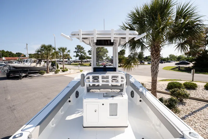 Slide: The Image of 2026 Blazer Bay Makaira 2600 boat, sleek design, parked near palm trees. - 7
