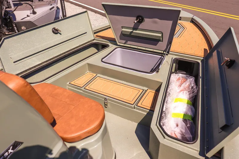 Slide: The Image of 2026 Avid 21 FSX boat interior with storage compartments and seating. - 14