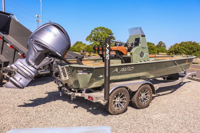 Slide: The Image of 2026 Avid 21 FSX boat on trailer with Yamaha outboard motor. - 3