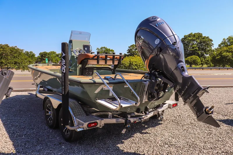 Slide: The Image of 2026 Avid 21 FSX boat with Yamaha outboard motor on trailer, parked outdoors. - 5