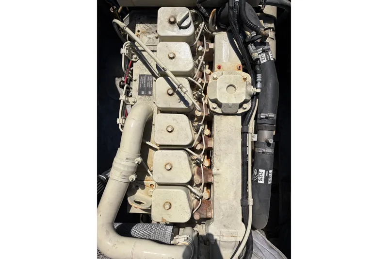 Slide: The Image of Engine of 1997 US Army M2R Bridge Erection Boat, showcasing mechanical components and hoses. - 3