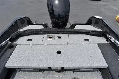 Slide: The Image of 2026 Lowe Fishing Machine 1675 WT boat interior with motor and storage compartments. - 10