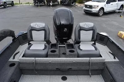 Slide: The Image of 2026 Lowe Fishing Machine 1675 WT boat interior with dual seats and motor. - 13
