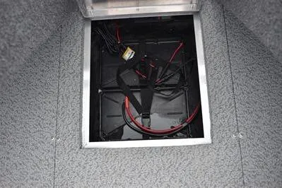 Slide: The Image of 2026 Lowe Fishing Machine 1675 WT battery compartment with wiring. - 16