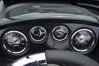 Slide: The Image of Dashboard of 2026 Lowe Fishing Machine 1675 WT with speedometer, trim, fuel, and RPM gauges. - 28