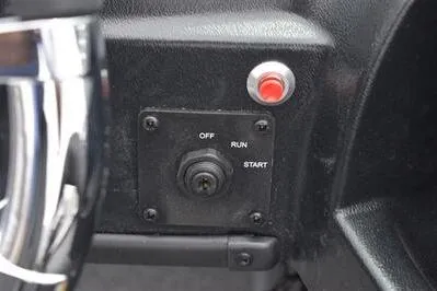 Slide: The Image of Control panel of 2026 Lowe Fishing Machine 1675 WT with ignition switch and red button. - 29