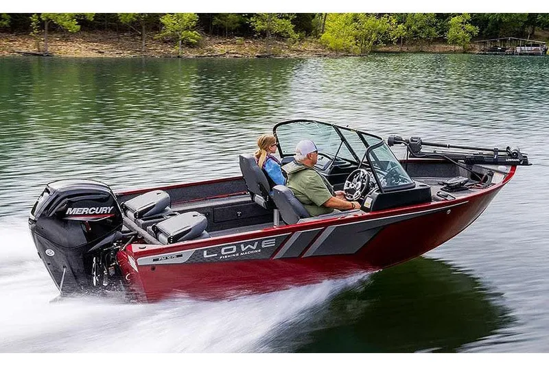 Slide: The Image of Manufacturer Provided Image: 2026 Lowe Fishing Machine 1675 WT boat cruising on a lake with two passengers. - 39