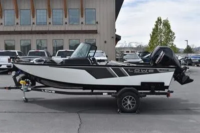 Slide: The Image of 2026 Lowe Fishing Machine 1675 WT boat on trailer, parked outdoors. - 4