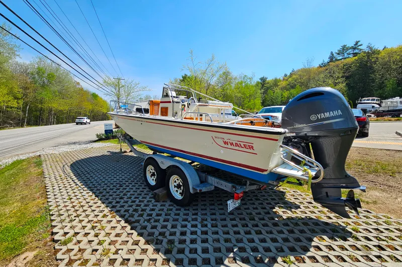 Slide: The Image of 1990 Boston Whaler OUTRAGE CUDDY boat on trailer with Yamaha outboard motor. - 3