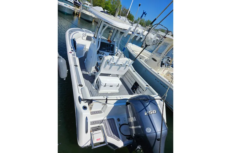 Slide: The Image of 2023 Tidewater boat with Yamaha 250 engine docked at marina. - 1