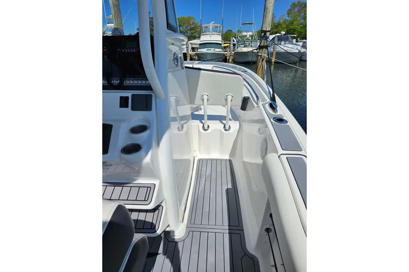 Slide: The Image of 2023 Tidewater boat interior with sleek design and modern features at a marina. - 4