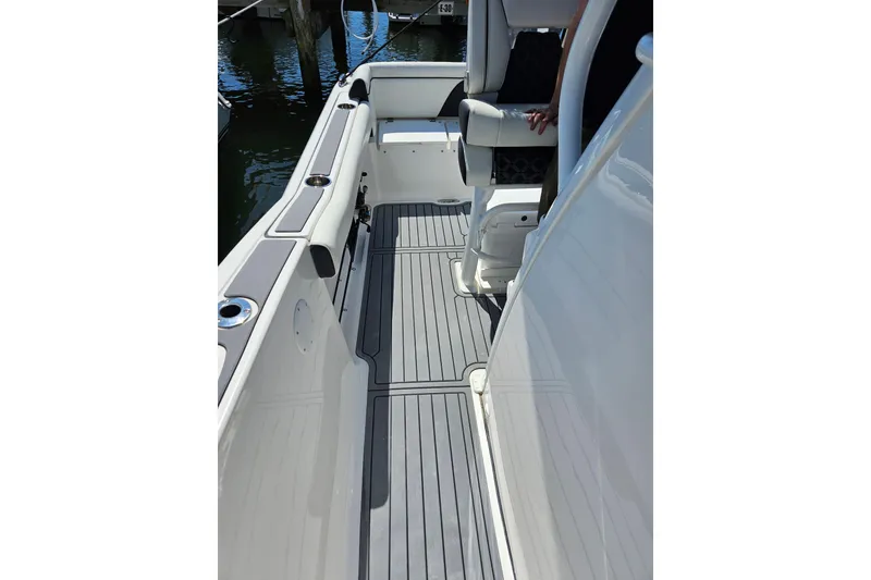 Slide: The Image of 2023 Tidewater boat interior with sleek seating and modern deck design. - 7