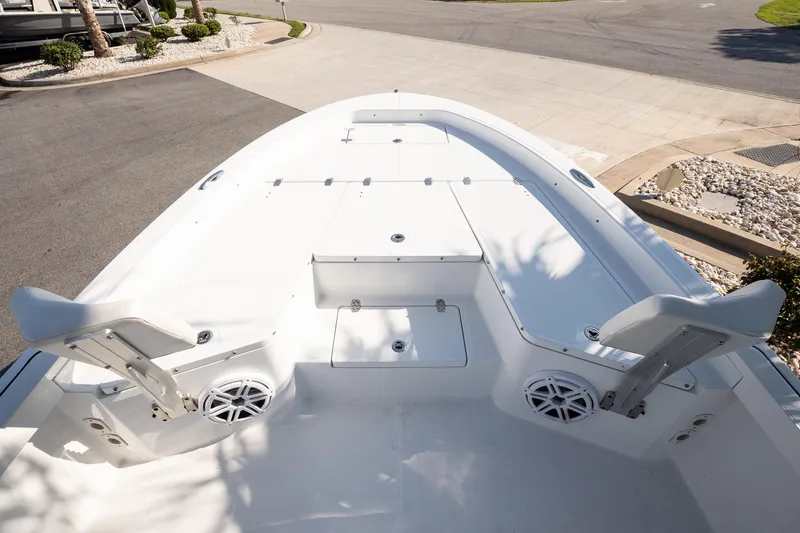 Slide: The Image of 2022 Wellcraft 241 Bay boat deck with seating and storage compartments. - 10