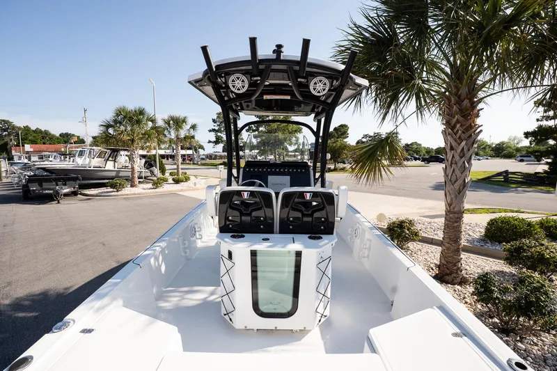 Slide: The Image of 2022 Wellcraft 241 Bay boat with modern console, parked near palm trees. - 7