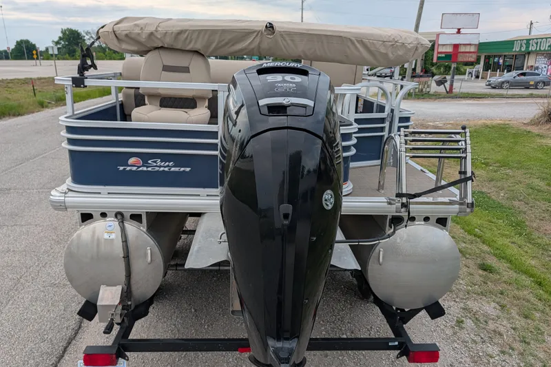 Slide: The Image of 2023 Sun Tracker Fishin' Barge 20 DLX pontoon boat with Mercury outboard motor. - 32