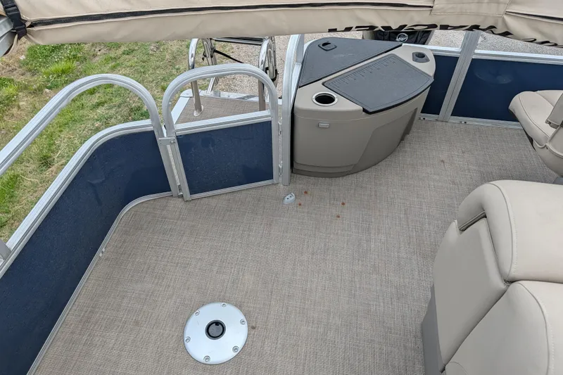 Slide: The Image of 2023 Sun Tracker Fishin' Barge 20 DLX interior with seating and storage area. - 43