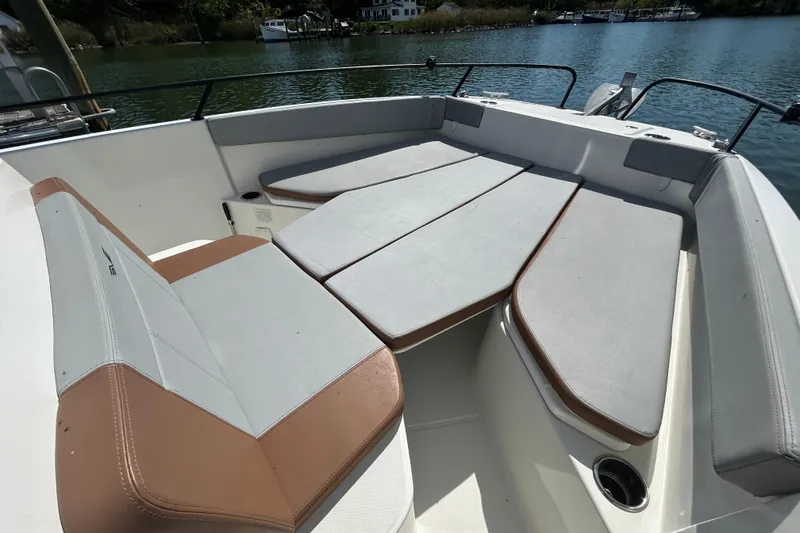 Slide: The Image of 2023 Beneteau Flyer 8 SPACEdeck with comfortable seating by the water. - 11