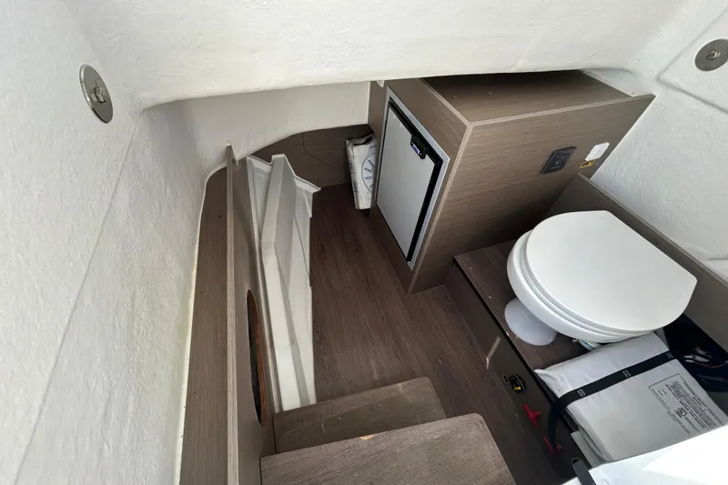 Slide: The Image of Interior of 2023 Beneteau Flyer 8 SPACEdeck with toilet and fridge. - 9
