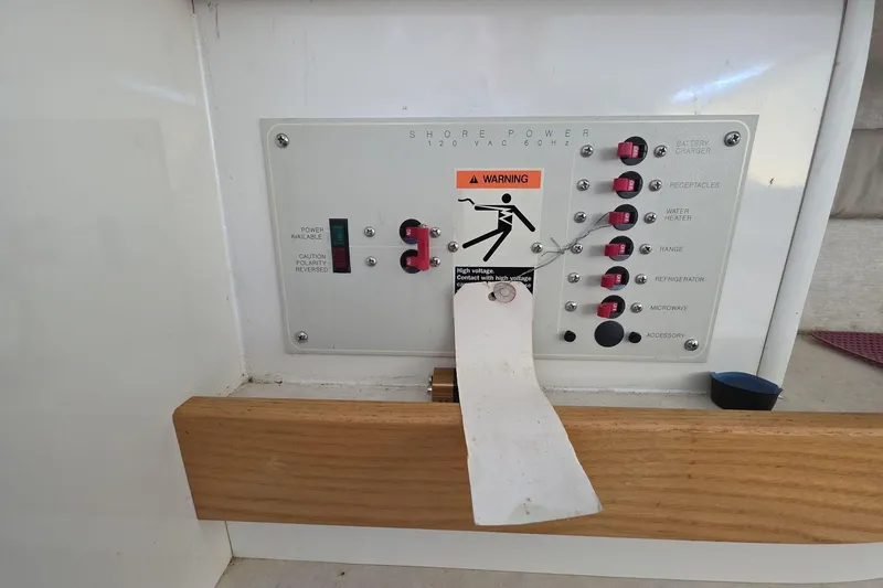 Slide: The Image of Electrical control panel on a 1999 Bayliner 2452 Ciera Express boat. - 7