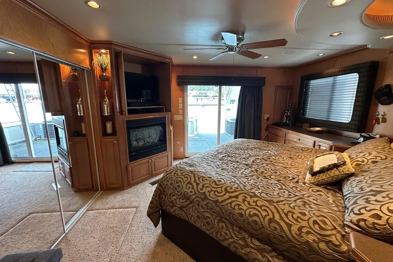 Slide: The Image of Luxurious 2004 Sumerset 18x96 houseboat bedroom with elegant decor and modern amenities. - 11