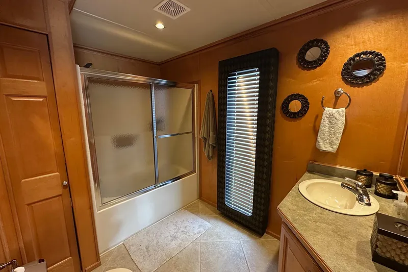 Slide: The Image of Bathroom interior of 2004 Sumerset 18x96 houseboat with shower and sink. - 12