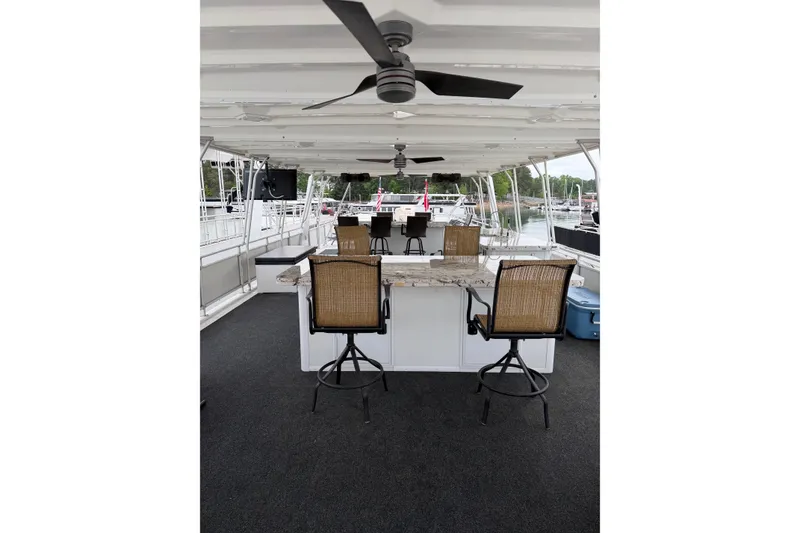 Slide: The Image of Luxurious 2004 Sumerset 18x96 houseboat deck with seating and ceiling fans. - 16