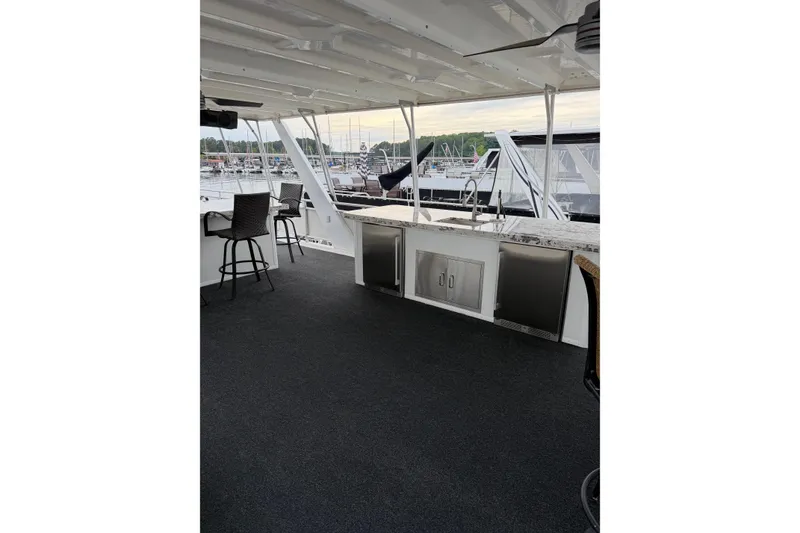 Slide: The Image of Outdoor deck of 2004 Sumerset 18x96 houseboat with seating and kitchenette. - 17