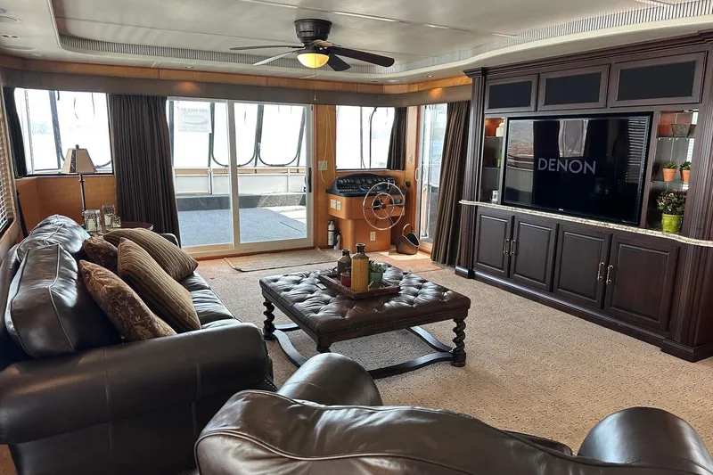 Slide: The Image of Luxurious 2004 Sumerset 18x96 houseboat interior with leather seating, entertainment center, and helm. - 3
