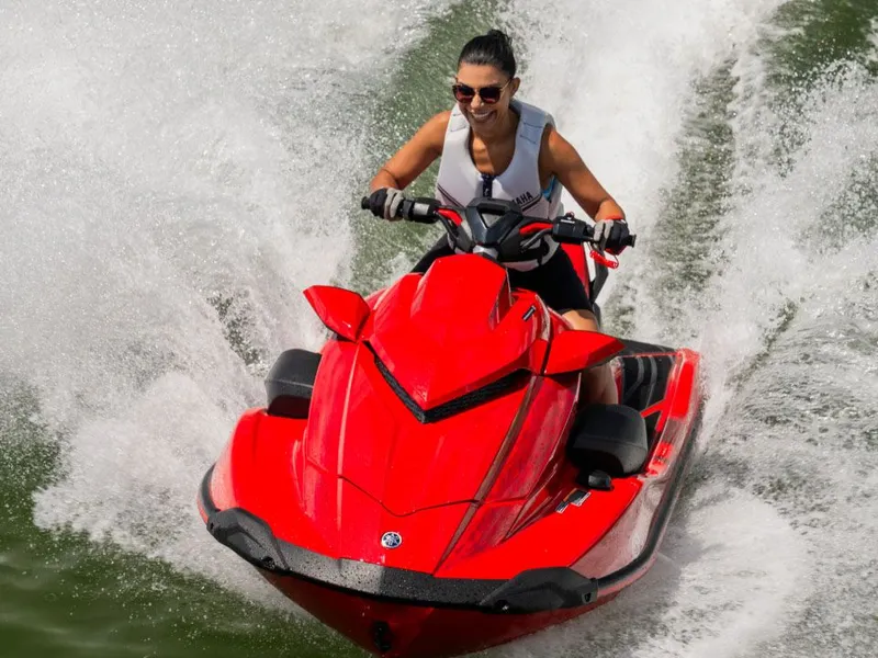 Slide: The Image of Woman riding 2026 Yamaha GP SVHO jet ski on water. - 11