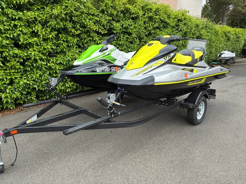 Slide: The Image of 2020 Yamaha VX Cruiser HO jet skis on trailer, green and yellow. - 3
