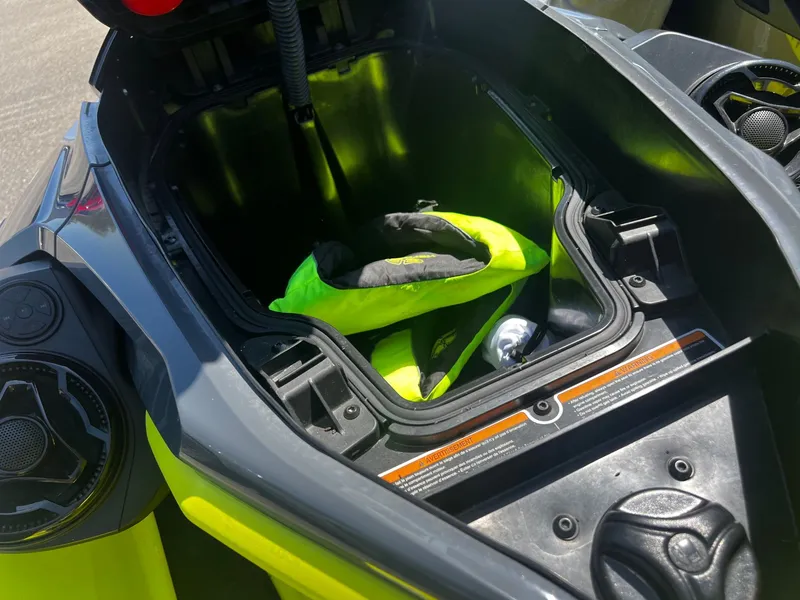 Slide: The Image of 2019 Sea-Doo RXT-X 300 iBR storage compartment with life jacket. - 5