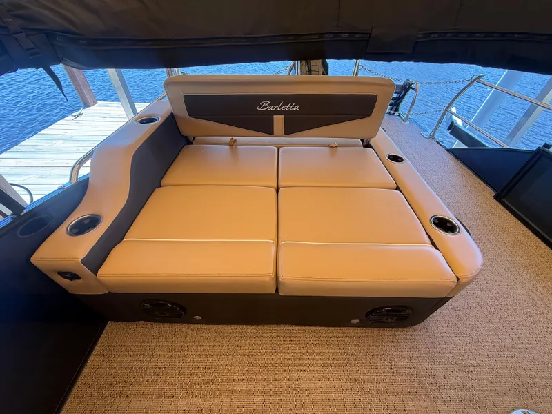 Slide: The Image of 2024 Barletta Cabrio 24 UETT boat seat with beige upholstery. - 11