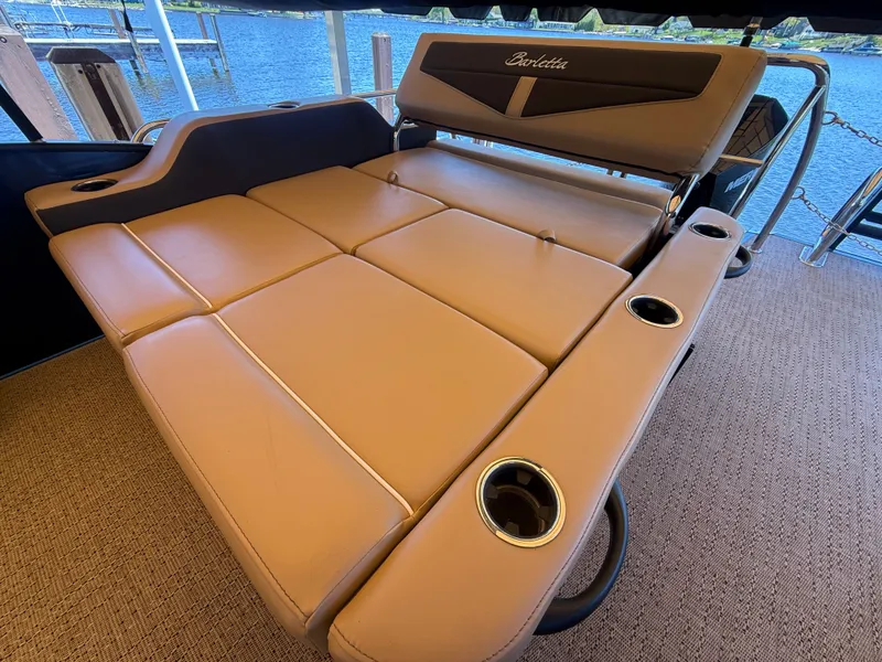 Slide: The Image of 2024 Barletta Cabrio 24 UETT lounge area with cup holders. - 13