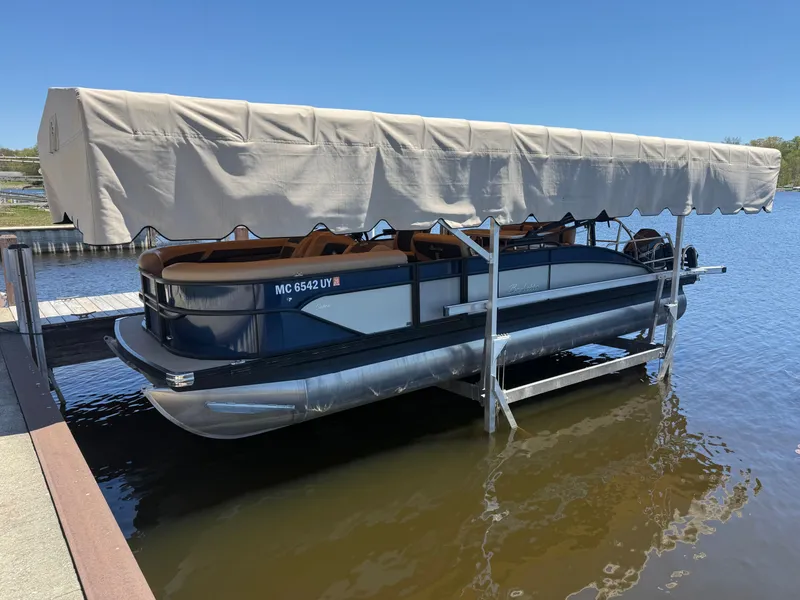 Slide: The Image of 2024 Barletta CABRIO 24 UETT pontoon boat at dock. - 18