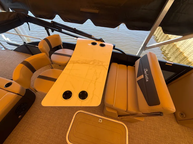 Slide: The Image of Interior of 2024 Barletta CABRIO 24 UETT with luxurious seating area. - 8