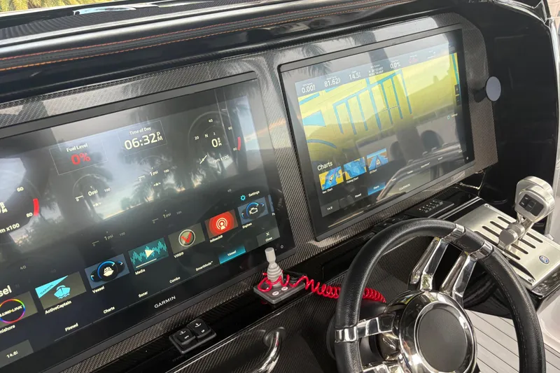 Slide: The Image of Dashboard of 2024 Nor-Tech 390 Sport Center Console with advanced navigation displays. - 12