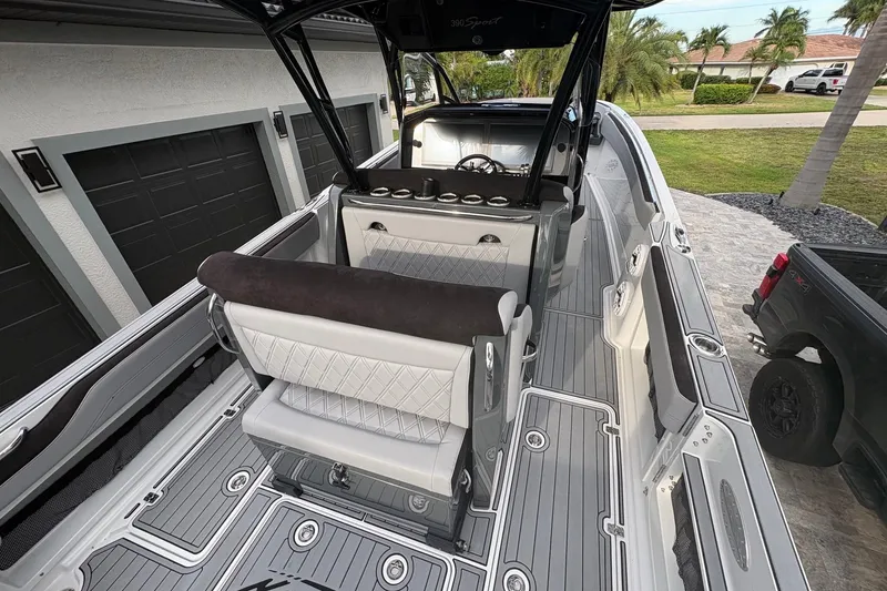 Slide: The Image of 2024 Nor-Tech 390 Sport Center Console boat interior with sleek seating and modern design. - 19