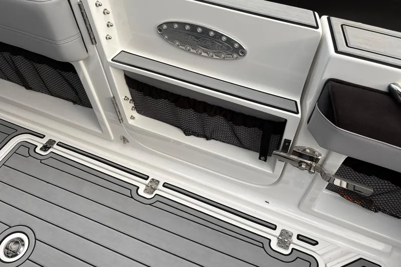Slide: The Image of 2024 Nor-Tech 390 Sport Center Console interior with storage compartments and sleek design. - 23
