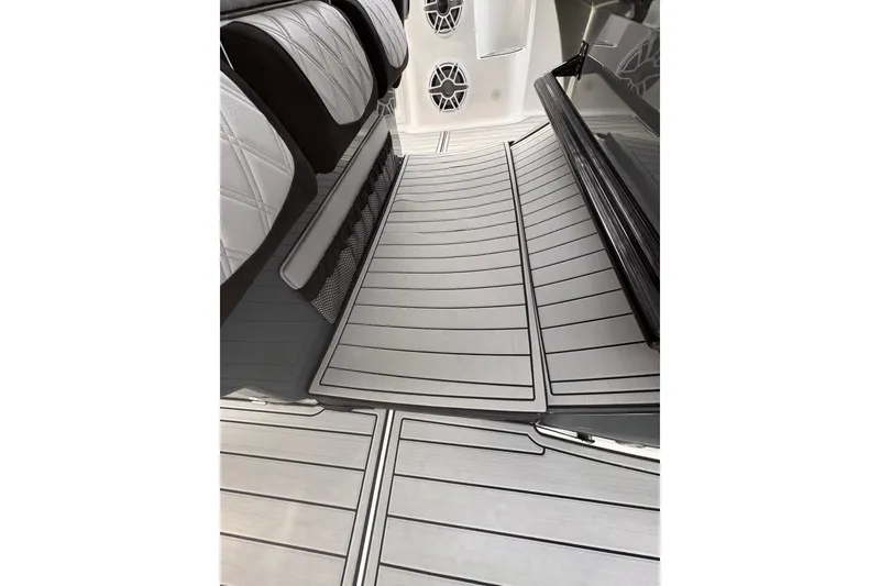 Slide: The Image of 2024 Nor-Tech 390 Sport Center Console interior with sleek, modern seating and flooring design. - 25
