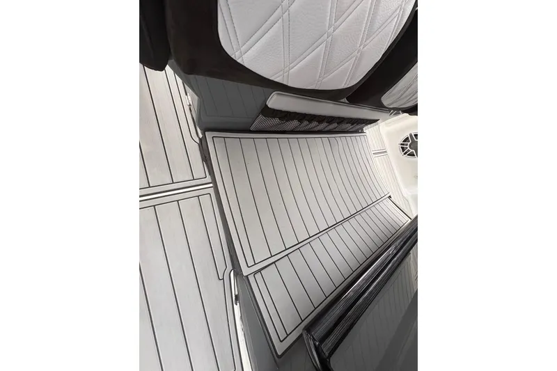 Slide: The Image of 2024 Nor-Tech 390 Sport Center Console interior with sleek, modern seating and flooring design. - 26