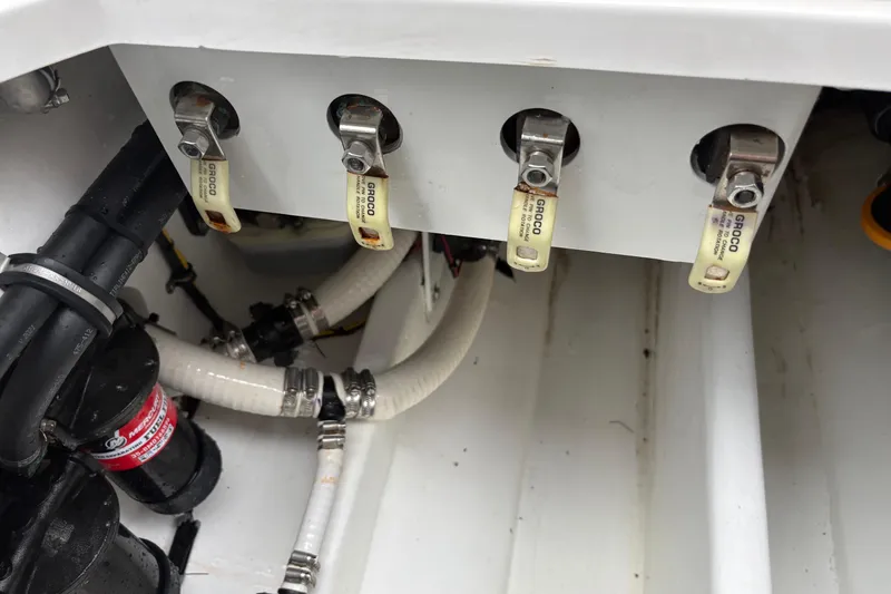 Slide: The Image of 2024 Nor-Tech 390 Sport Center Console boat plumbing and valve system. - 30