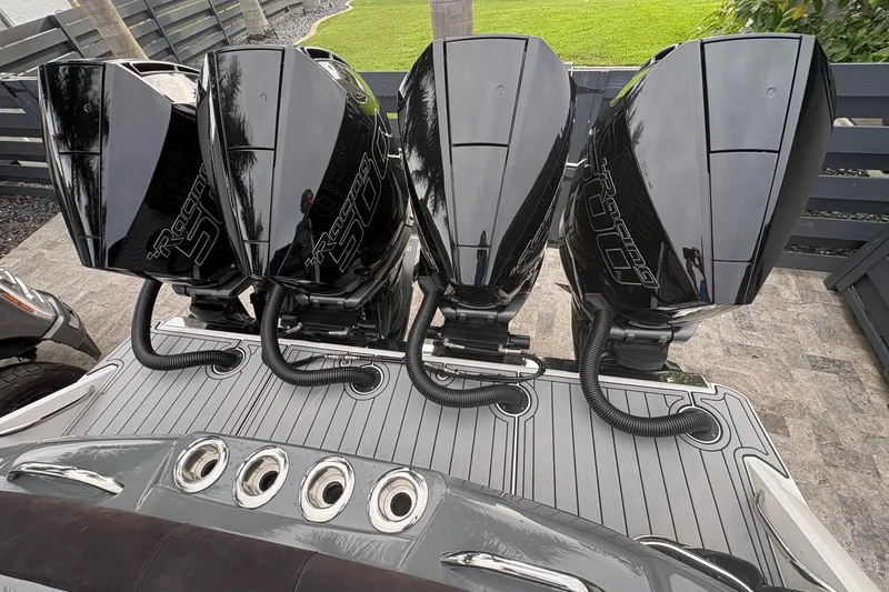 Slide: The Image of 2024 Nor-Tech 390 Sport Center Console with four powerful outboard engines. - 32