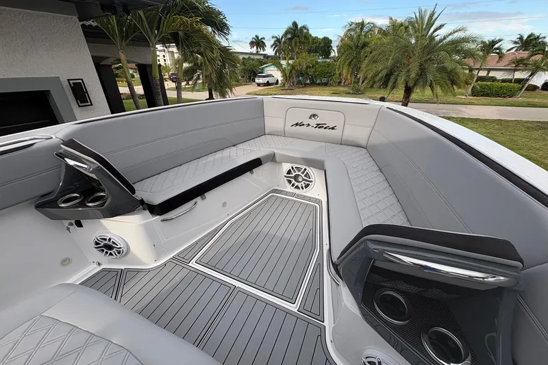 Slide: The Image of 2024 Nor-Tech 390 Sport Center Console boat interior with sleek seating and modern design. - 6