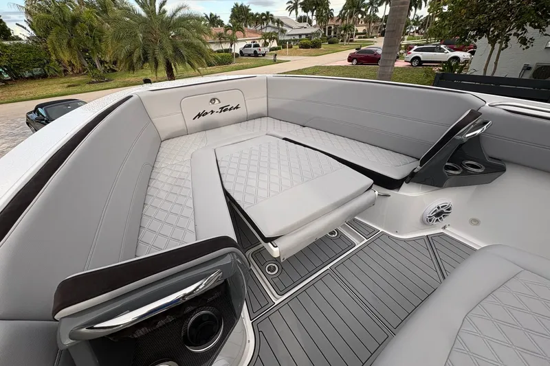 Slide: The Image of 2024 Nor-Tech 390 Sport Center Console with luxurious seating and modern design. - 7