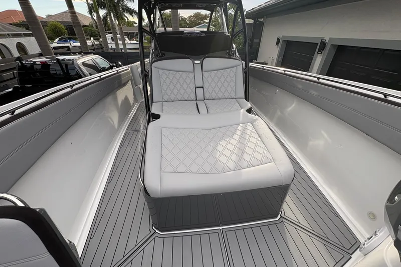 Slide: The Image of 2024 Nor-Tech 390 Sport Center Console with luxurious seating and sleek design. - 9