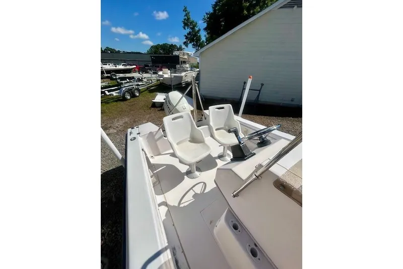 Slide: The Image of 1994 Grady-White Spirit 175 boat with white seats outdoors. - 6