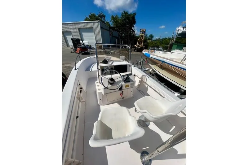 Slide: The Image of Interior view of a 1994 Grady-White Spirit 175 boat outdoors. - 8