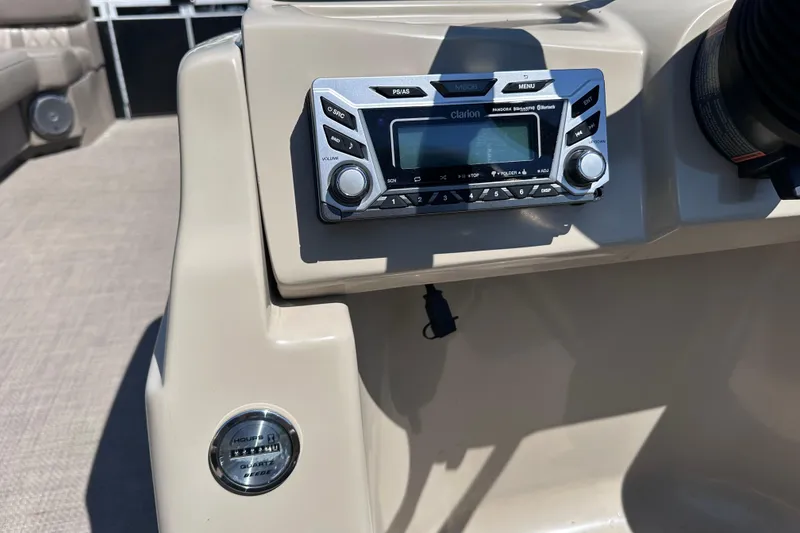 Slide: The Image of Clarion stereo system on 2015 JC 24 Tri-Toon boat dashboard. - 14