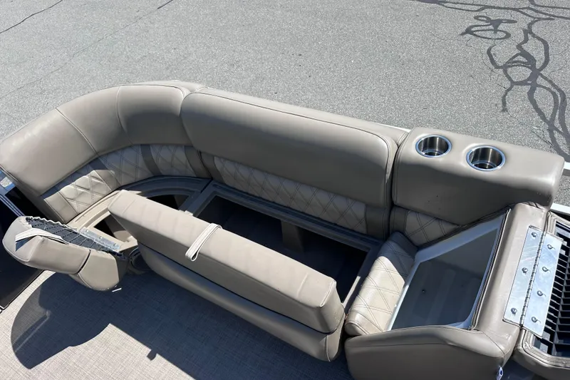 Slide: The Image of 2015 JC 24 Tri-Toon boat seating with cup holders and storage compartments. - 19